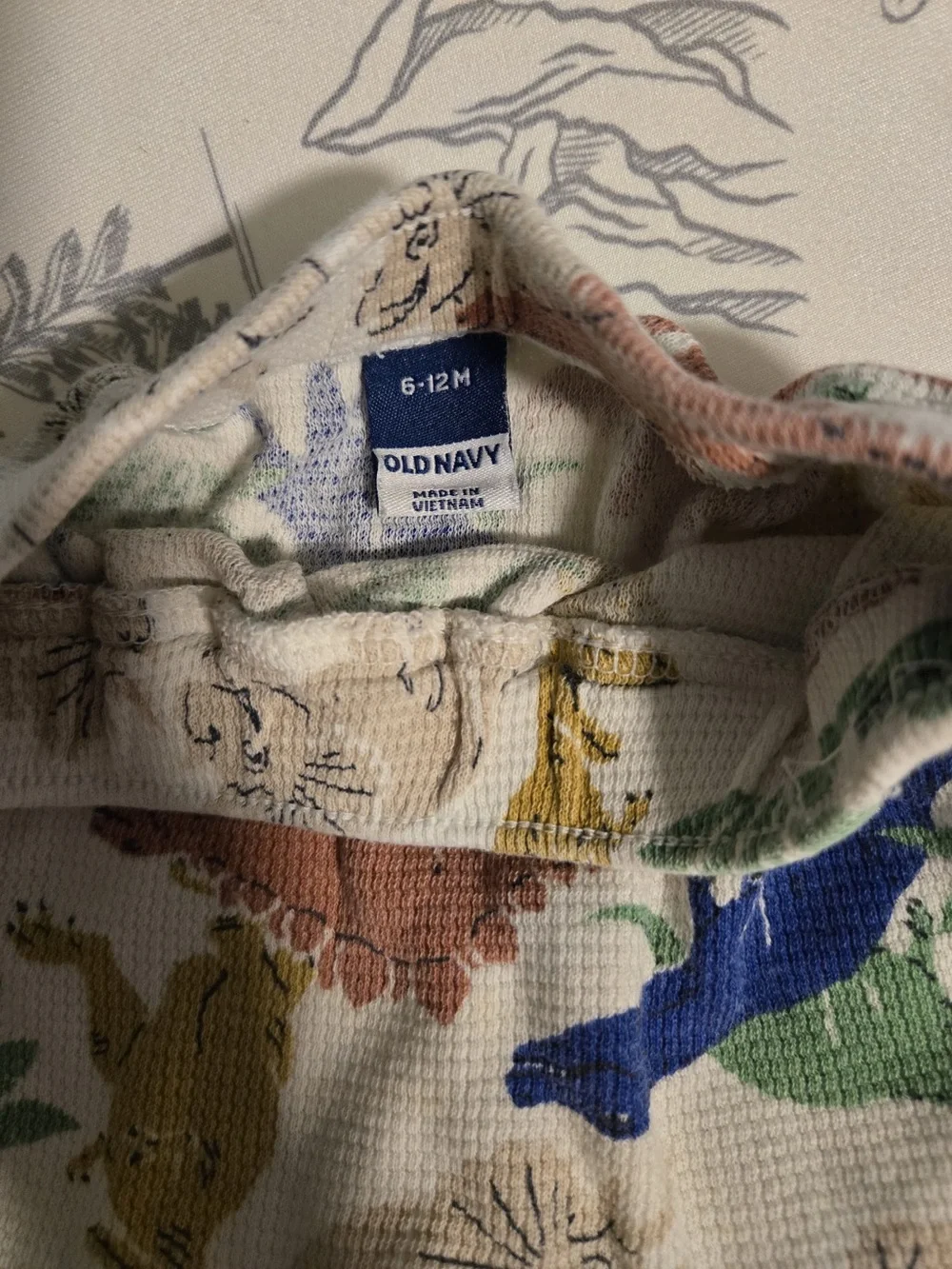 Old Navy Cream Knit Baby Shorts with Multicolor Dinosaur Print